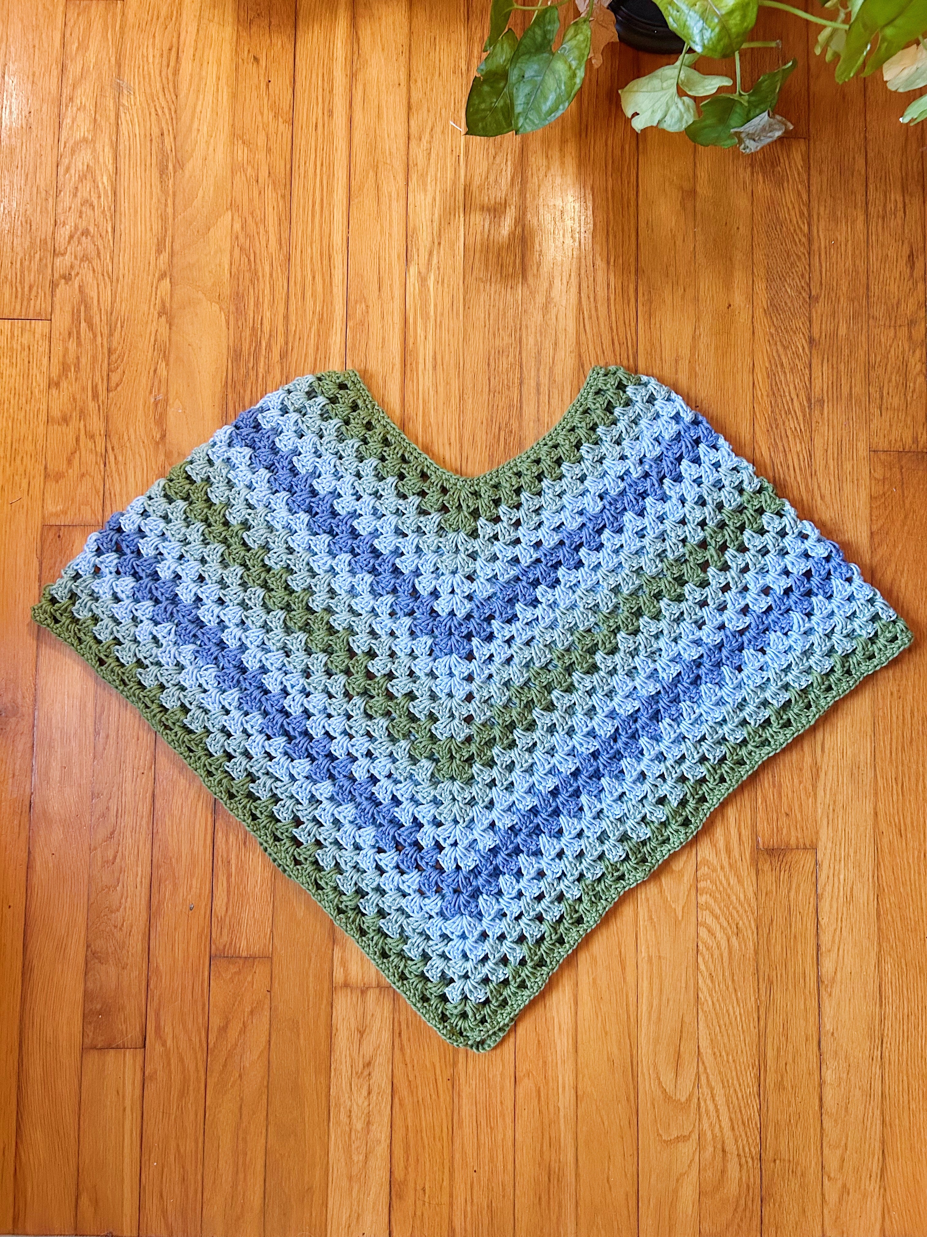 Green and blue striped poncho